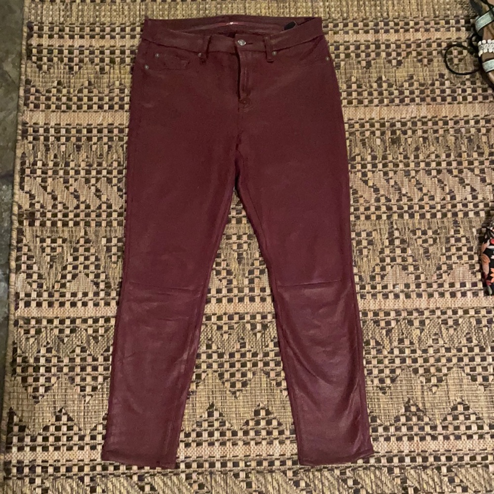 Coated maroon skinny jeans